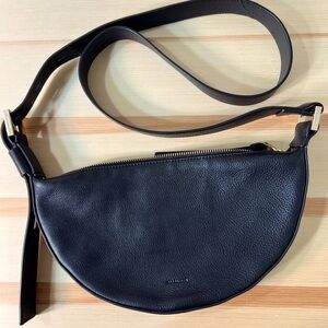 All Saints half Moon Crossbody bag in black.